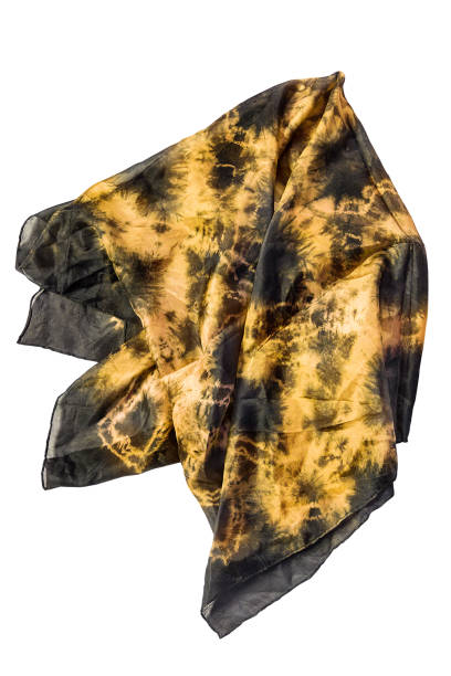 Folded yellow and black silk vintage kerchief isolated over white